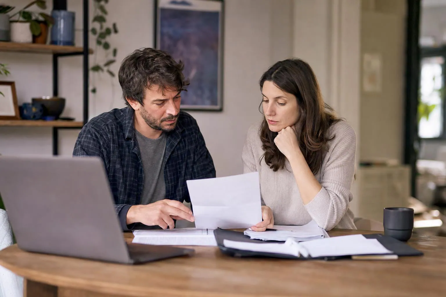Small business owner and partner reviewing documents in a quiet workspace